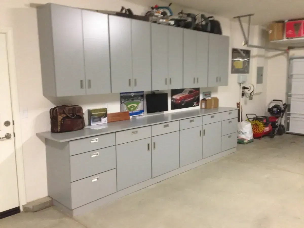 Wall-to-wall utility storage by G & L Cabinets