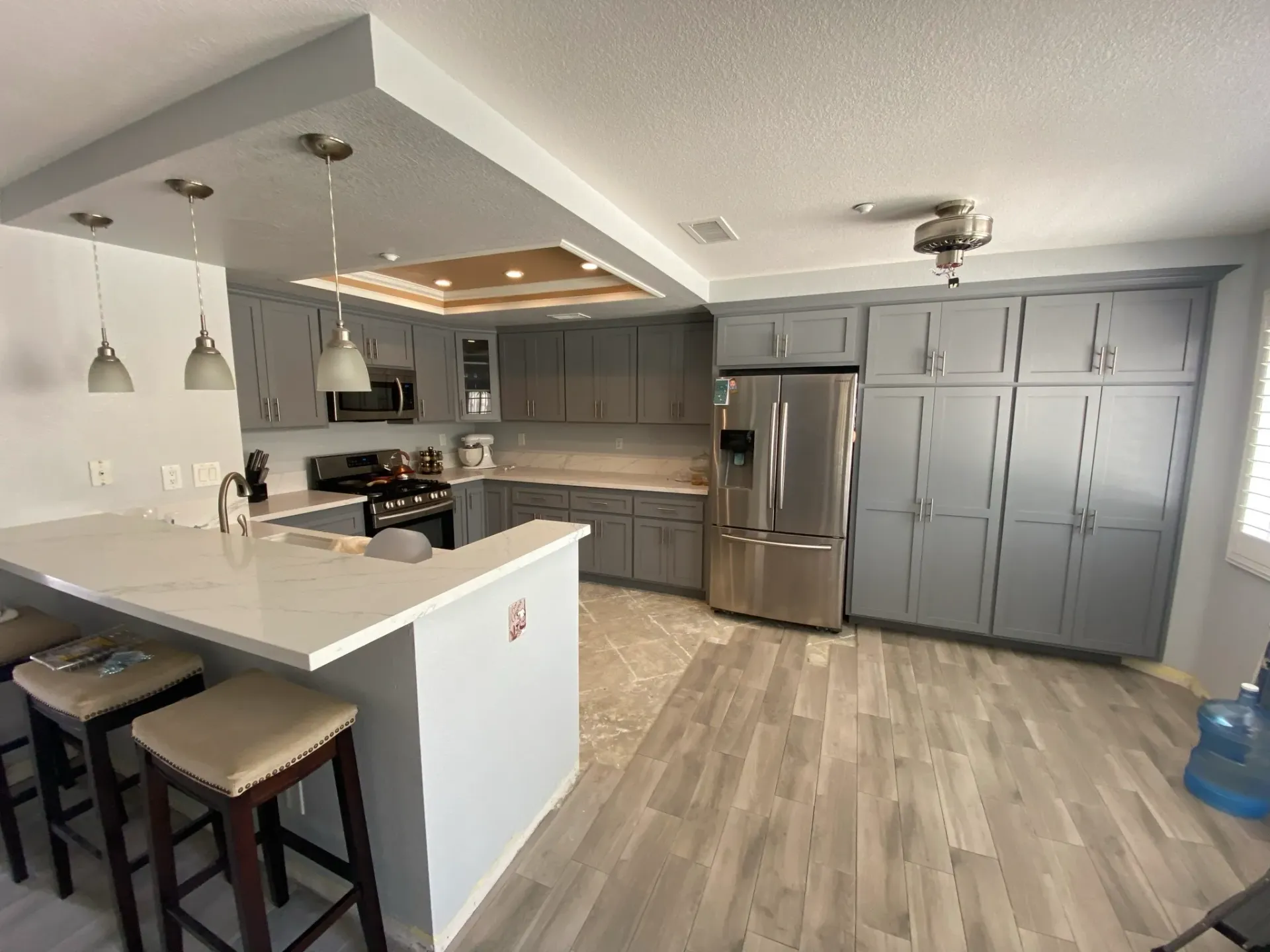 Gray custom kitchen cabinetry by G & L Cabinets
